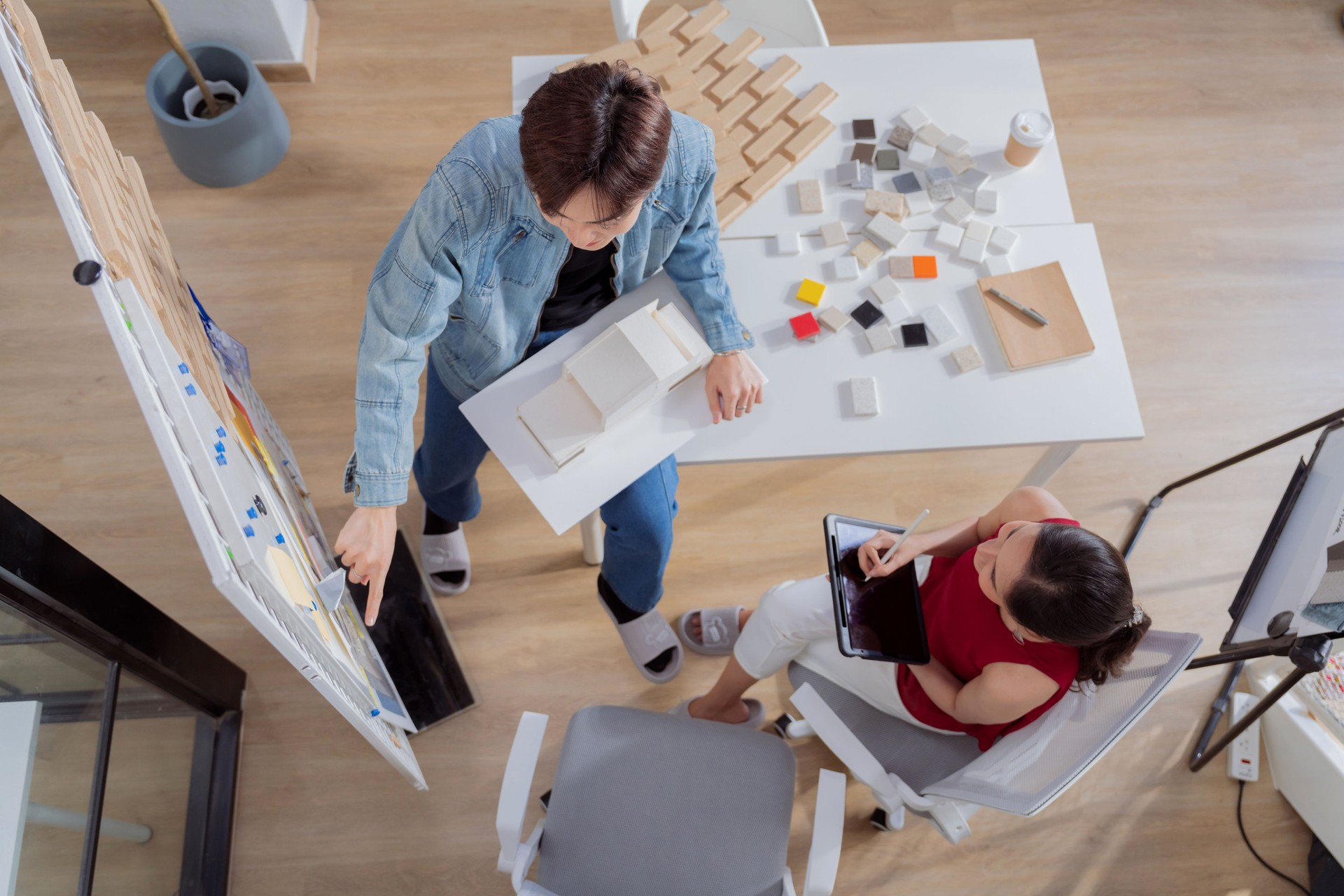 Meeting in a modern architectural office asian architect and interior designer working creative space planing design discuss brainstorm ideas sharing together Architect Team working best solution