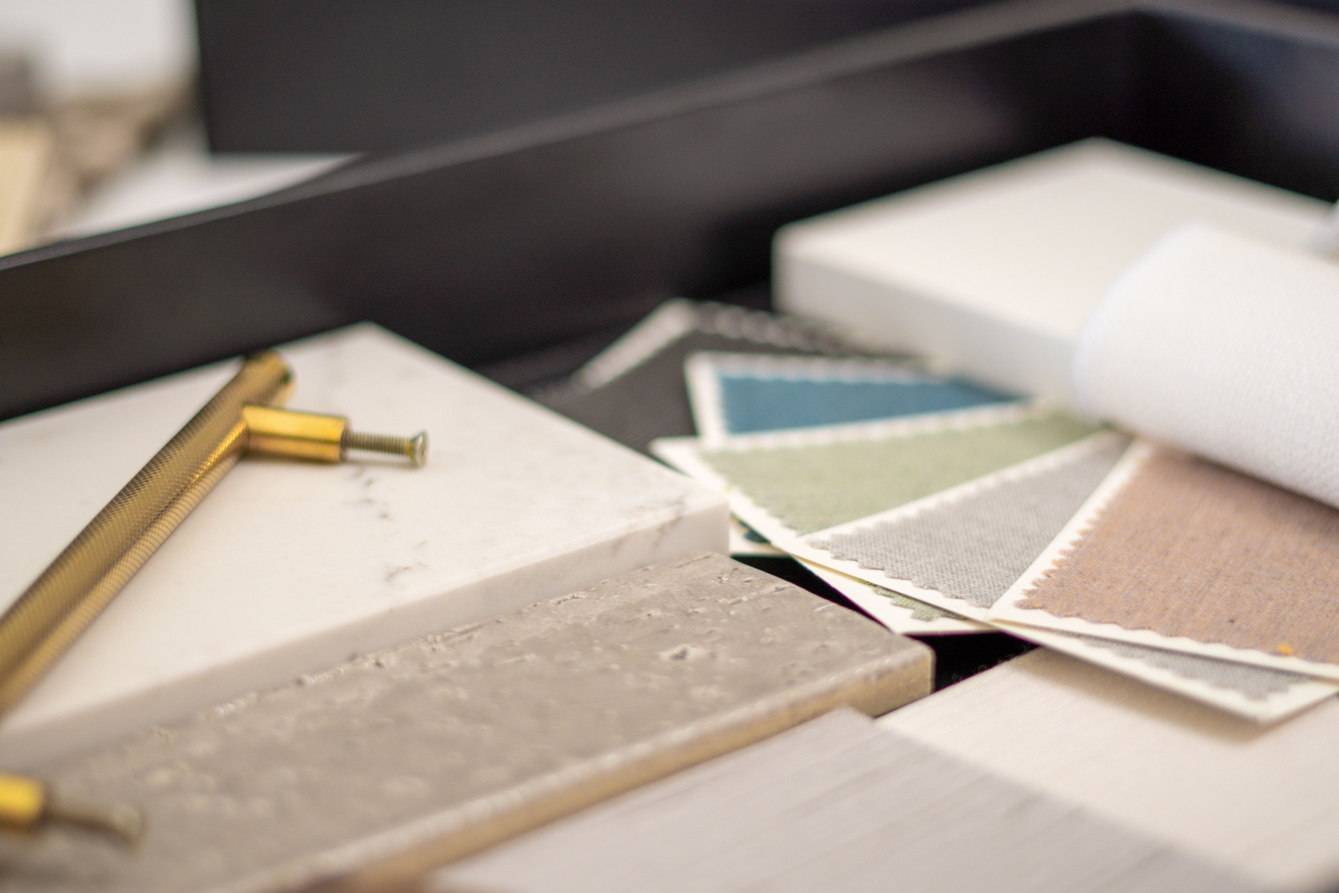 Interior designer's working table, an architectural plan of the house, a color palette