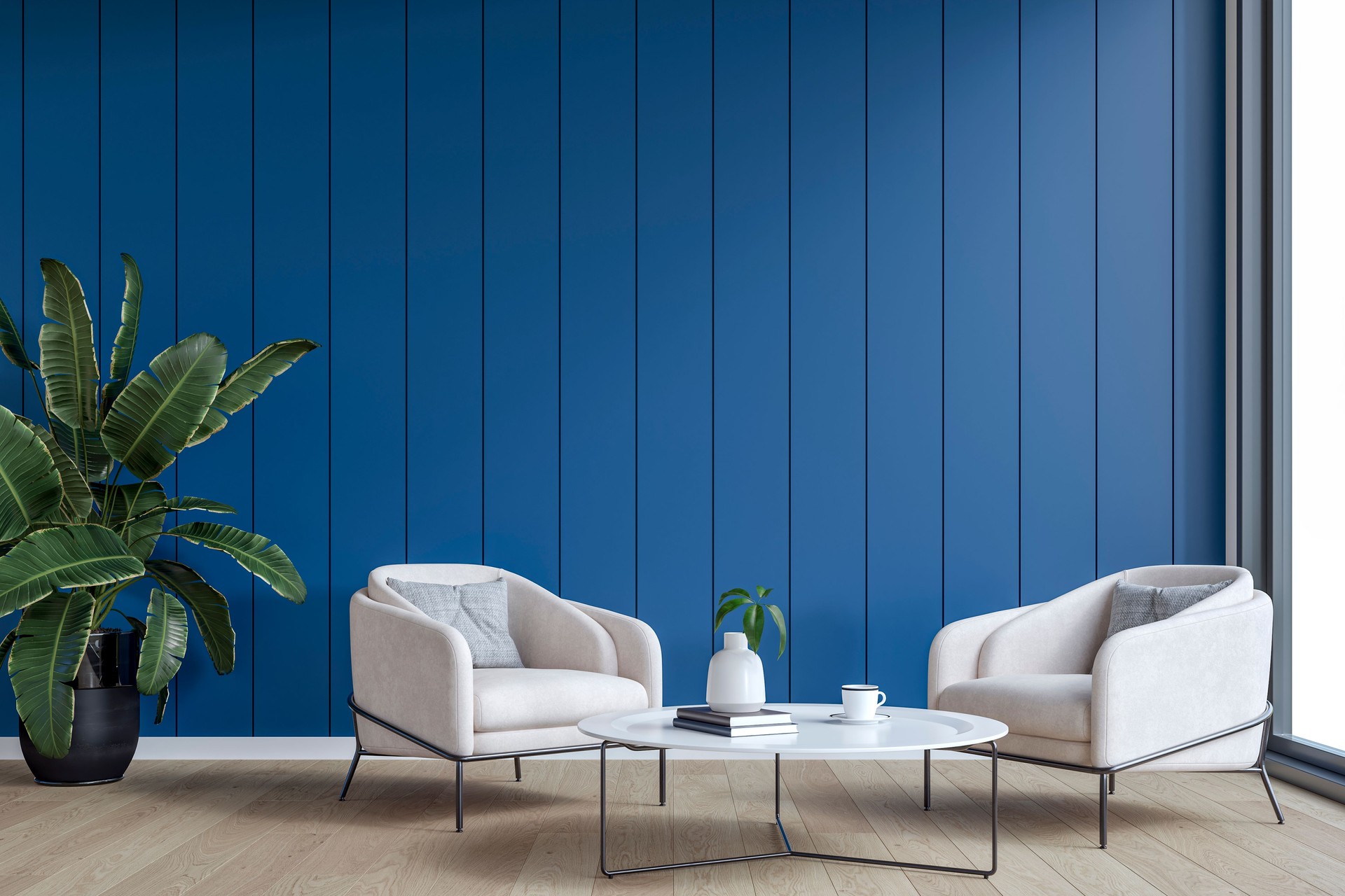 Modern interior: a living/waiting room with a couple of cozy armchairs, denim blue paneled accent wall background and decoration
