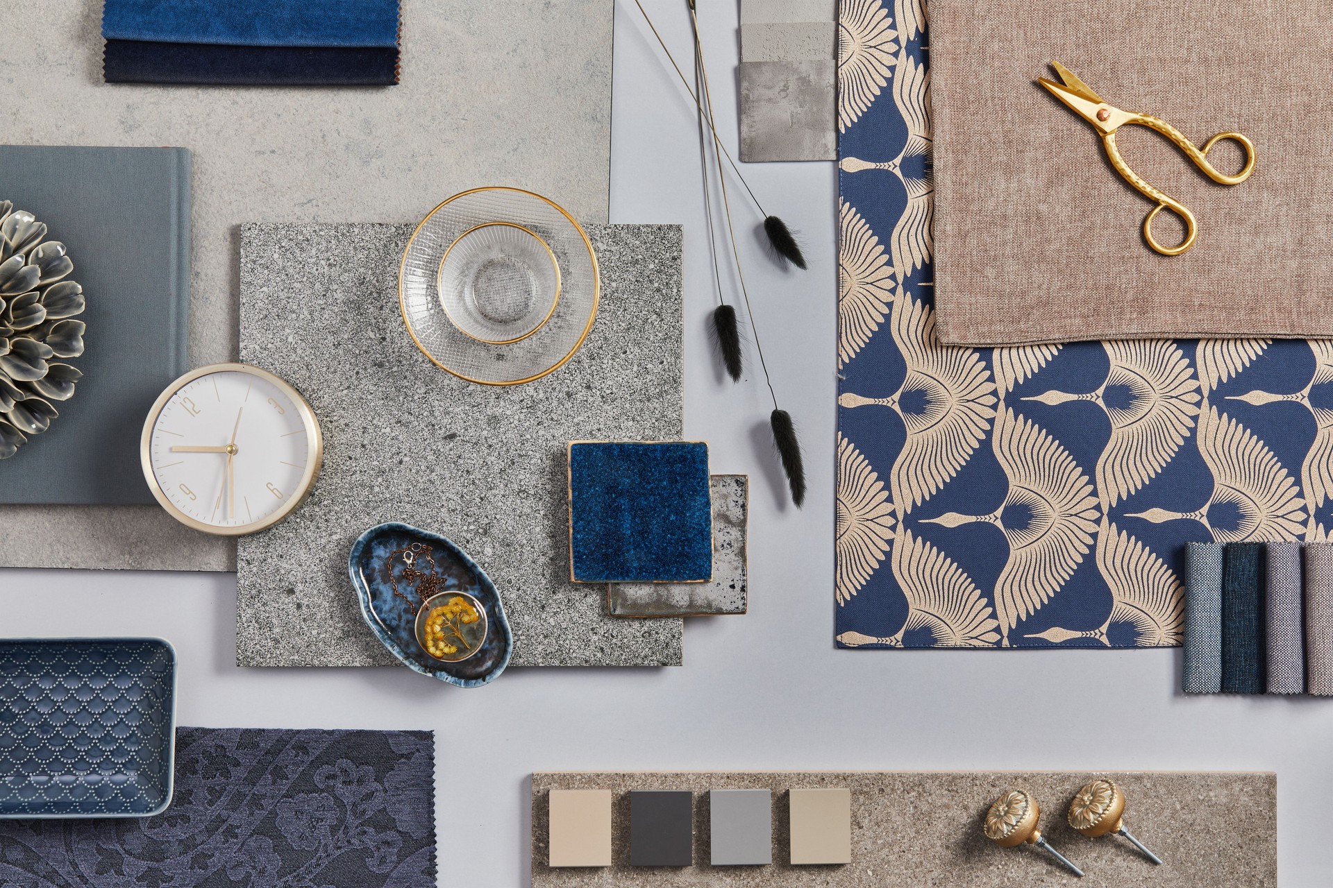Flat lay of creative architect moodboard composition with samples of building, textile and natural materials and personal accessories. Top view, grey background, template.